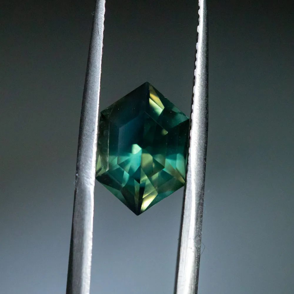 3.33CT ELONGATED HEXAGON UNTREATED NIGERIAN SAPPHIRE, DEEP GREEN WITH SILK, 11.31X7.50X5.37MM