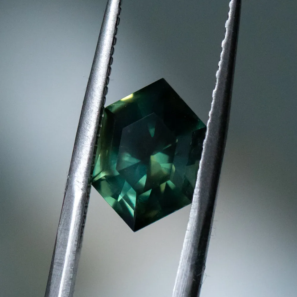 3.33CT ELONGATED HEXAGON UNTREATED NIGERIAN SAPPHIRE, DEEP GREEN WITH SILK, 11.31X7.50X5.37MM