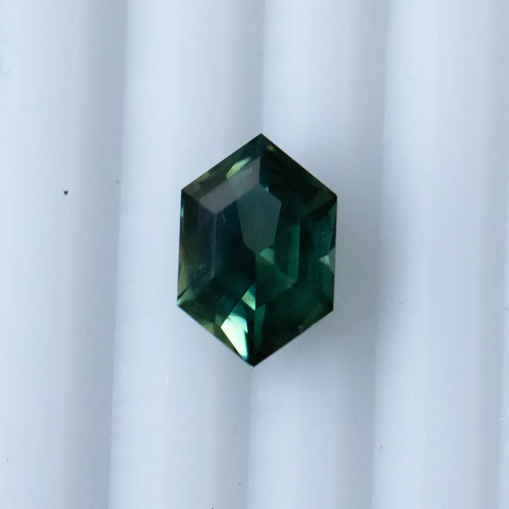 3.33CT ELONGATED HEXAGON UNTREATED NIGERIAN SAPPHIRE, DEEP GREEN WITH SILK, 11.31X7.50X5.37MM