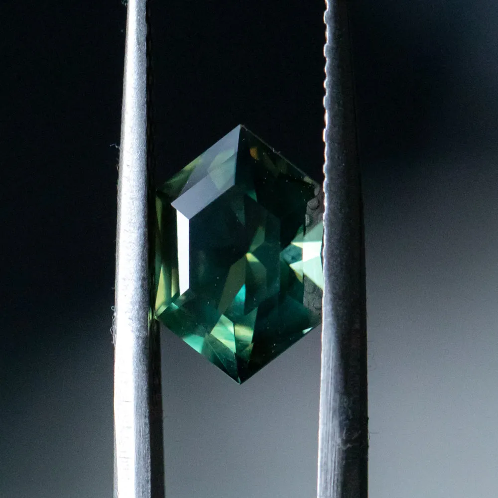 3.33CT ELONGATED HEXAGON UNTREATED NIGERIAN SAPPHIRE, DEEP GREEN WITH SILK, 11.31X7.50X5.37MM