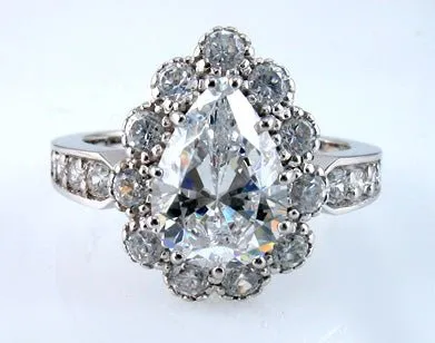 Pear Cut Cubic Zirconia Halo Engagement Ring in White Gold Plated Sterling Silver